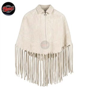 Women's genuine suede leather fringe western boho cape poncho — A cream-colored suede poncho featuring a classic collar, a single silver-toned metal hook-and-eye closure at the neckline, and a horizontal seam across the chest. The hem is adorned with