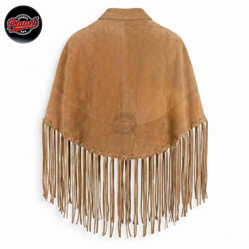 Women's genuine suede leather fringe western boho cape poncho — A tan suede poncho featuring a wide collar and a curved hemline adorned with long, thin fringe detailing. The garment is constructed with a whipstitch edge along the bottom seam where th