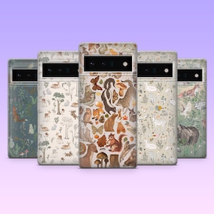 May include: Five phone cases with nature-themed designs. The cases feature illustrations of woodland animals, including foxes, deer, bears, and squirrels, along with butterflies, mushrooms, and foliage. The colour palette includes greens, browns, and creams.