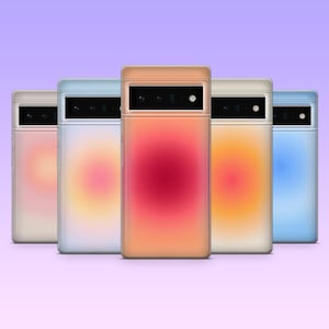 May include: Five colourful phone cases in a row, each with a gradient design. The cases are in shades of pink, blue, orange, and beige. The phone cases have a rectangular shape with a camera cutout at the top.