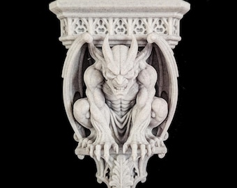 May include: A light gray stone-textured wall bracket featuring a crouching gargoyle figure with wings spread. The top shelf has a decorative lattice pattern, and the base is adorned with a pointed leaf-like carving. The figure has sharp claws.