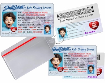 May include: A collection of South Dakota Kids Drivers Licenses featuring a child's photo. The licenses display personal details, a barcode, and the text "SAFE DRIVER PROMISE". The licenses are presented in a clear plastic holder.
