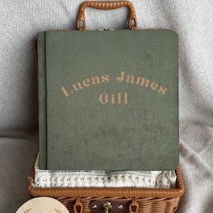 May include: A rustic wooden sign with the text "Welcome to our home" in white lettering. The sign features a distressed finish and a simple, inviting design, perfect for entryway decor.