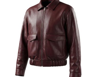 May include: A burgundy leather jacket with a zip-up front, two front pockets, and a ribbed hem and cuffs. The jacket has a classic collar and a smooth, polished finish. This outerwear piece is a stylish addition to any wardrobe.