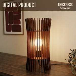 May include: A wooden table lamp with a warm, inviting glow. The lamp features a cylindrical design with vertical wooden slats, and a visible lightbulb. The text "DIGITAL PRODUCT" and "THICKNESS 3mm 4mm" are visible.