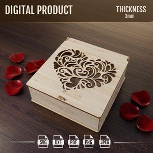 May include: A light-colored wooden box with a heart-shaped cutout on the lid. The box is rectangular and has a hinged lid. The text "DIGITAL PRODUCT" and "THICKNESS 3mm" are at the top. Red rose petals are scattered around the box. File type icons are at the bottom.