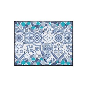 May include: A rectangular desk mat featuring a repeating pattern of blue and white tiles with intricate floral and geometric motifs. The design includes accents of bright turquoise in a mosaic style, all bordered by a solid black stitched edge.