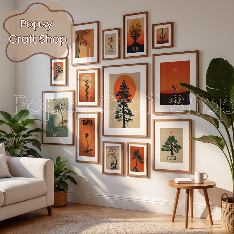 May include: A collection of framed art prints with a travel theme, featuring illustrations of trees, landscapes, and text. The prints are in warm tones of orange, brown, and beige, with wooden frames. The wall art is displayed above a white sofa and a wooden side table.