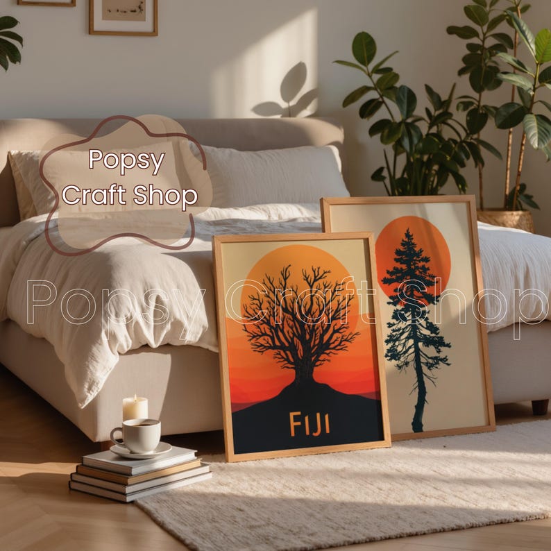 May include: Two framed art prints featuring a tree silhouette against a sunset. One print has the word "FIJI" at the bottom. The other print features a pine tree silhouette. Both are in wooden frames.