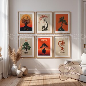 May include: Six framed art prints with nature-themed illustrations. Each print features a tree or plant with a sunset or landscape background. The prints include the words "FIJI", "TOKYO", "PERU", and "DUBAI".