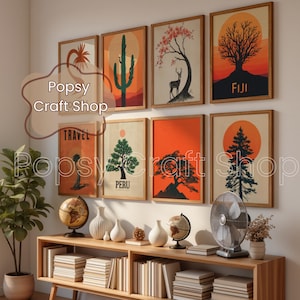 May include: A collection of framed art prints featuring nature-themed illustrations, including trees, cacti, and a deer, set against sunset-colored backgrounds. The prints are displayed above a wooden console with decorative items.