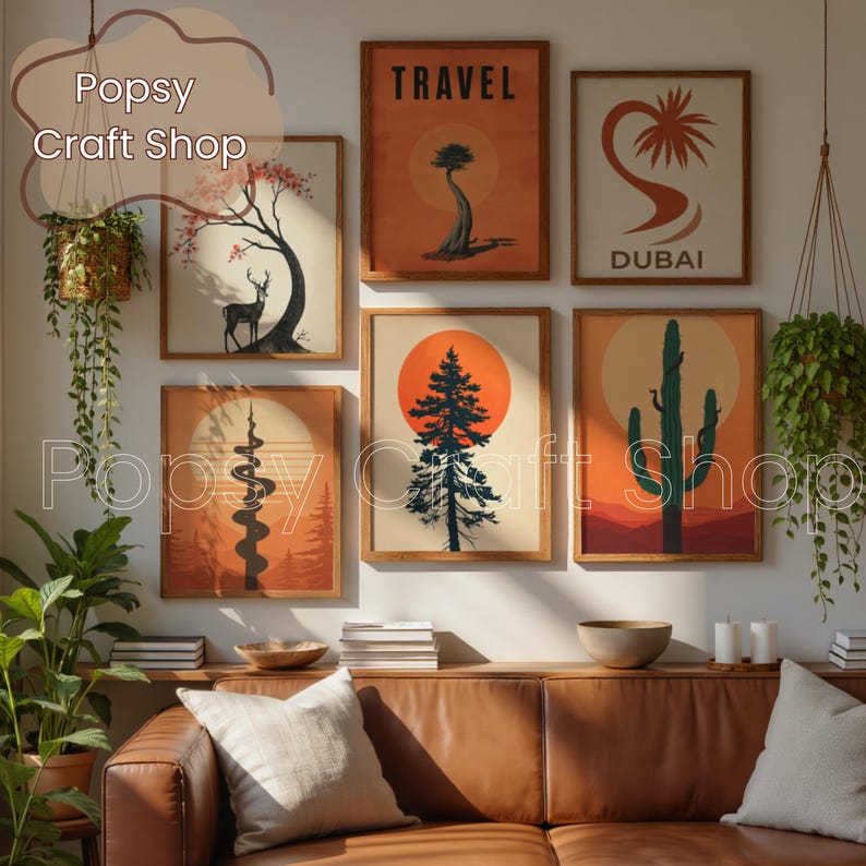 May include: A collection of framed art prints with nature-themed illustrations. The prints feature images of trees, a deer, a cactus, and the word "TRAVEL". The color palette includes orange, brown, and cream.