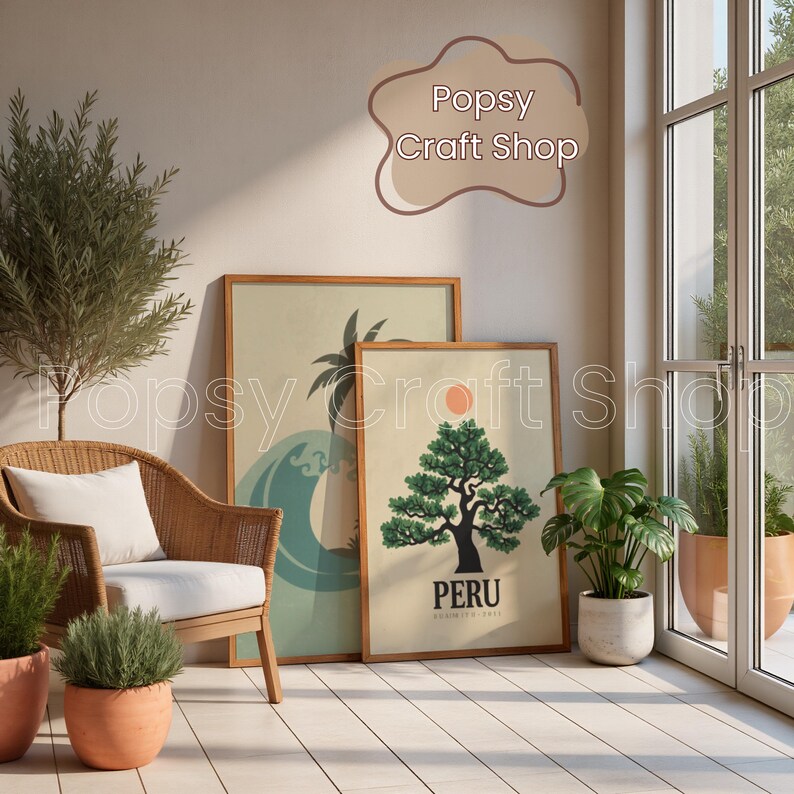 May include: Two framed art prints leaning against a wall. One features a wave and palm tree design, the other a tree with a sun and the word "PERU". A wicker chair with a white cushion and potted plants are in the foreground.