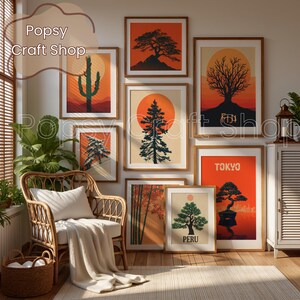 May include: A collection of framed art prints featuring stylized landscapes with trees, cacti, and sunsets in shades of orange, red, and green. The prints are displayed on a wall above a wicker chair and a woven basket.