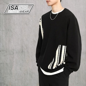 May include: Black crew neck sweater with white accents and the text "ISABEL STREETWEAR" in a white and black logo. The sweater has a white trim at the neckline and cuffs, and a white stripe design on the front.