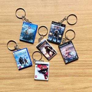 GOW Nyckelringsset, Minispelsfodral Gamertillbehör nyckelring present | Reptålig + Vattentålig