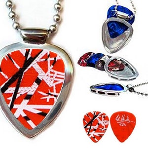 May include: A silver guitar pick necklace with a red, white, and black guitar pick design. The pick is attached to a silver chain and has a silver ring for hanging. The pick is also shown in a close-up view, revealing the design in detail.