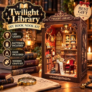 May include: A Twilight Library DIY book nook kit featuring a miniature room with a fireplace, a red armchair, bookshelves, and a deer head wall mount. The wooden structure includes LED lights, and the set comes with glue and batteries included.