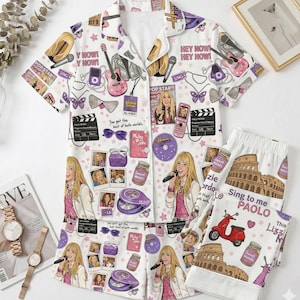 May include: White pajama set with a repeating pattern of a pop star, microphones, guitars, and other themed graphics. The set includes a short-sleeved button-up shirt and matching shorts. Text includes "HEY NOW!" and "Sing to me PAOLO".