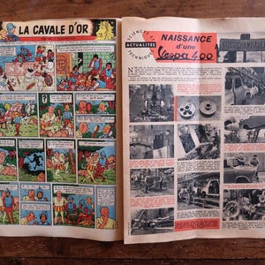 May include: A vintage magazine open on a wooden surface, displaying a comic strip titled "LA CAVALE D'OR" and articles about the Vespa 400. The comic strip is in colour, and the articles are in black and white with red highlights.