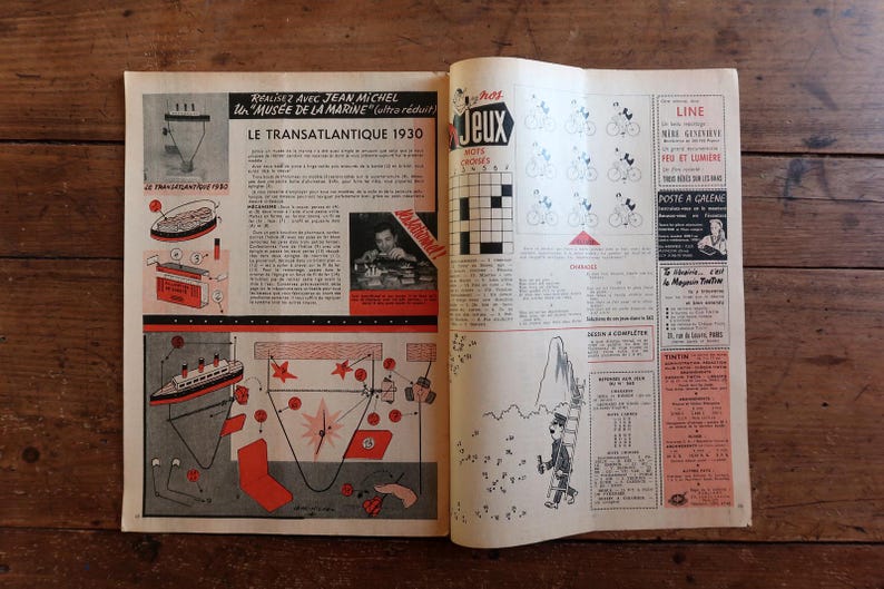 May include: Open vintage magazine pages with illustrations and text. The left page features a diagram of a ship and text in French, including "LE TRANSATLANTIQUE 1930." The right page has crossword puzzles and other graphics.