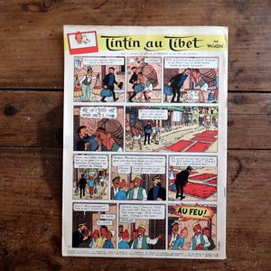 May include: A vintage comic book page titled Tintin au Tibet by Herg&eacute;, featuring multiple colorful panels with illustrations of characters in various settings, including street scenes and dialogue bubbles with French text throughout the page.