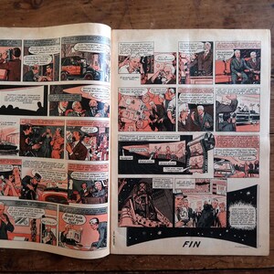 May include: A vintage comic book spread featuring multiple panels with black, white, and orange illustrations. The narrative depicts various scenes including people in suits, a film projector, and a car. The final panel includes the text FIN.