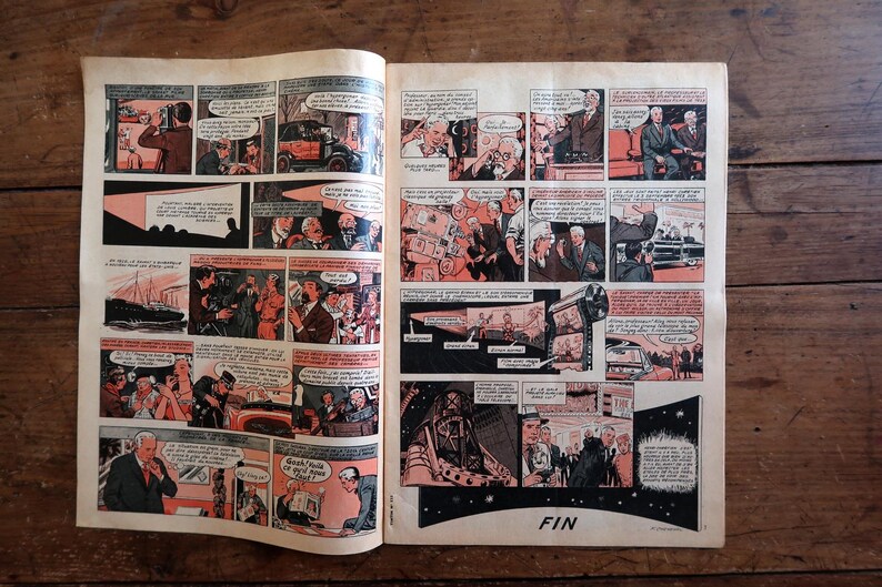 May include: A vintage comic book spread featuring multiple panels with black, white, and orange illustrations. The narrative depicts various scenes including people in suits, a film projector, and a car. The final panel includes the text FIN.