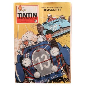 May include: A vintage Tintin comic book cover featuring a yellow background with the title TINTIN and the text NOTRE HISTOIRE COMPLETE: BUGATTI. The illustration depicts two blue race cars with drivers in helmets, one numbered 13 and one numbered 28.