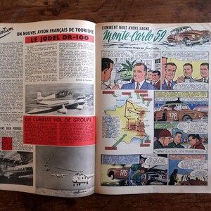 May include: Open magazine pages with vintage aviation and automotive illustrations. One page features a plane and the text "LE JODEL DR-100". The other page shows a car and the text "Monte-Carlo 59".