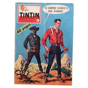 May include: Vintage comic book cover featuring two cowboys in a desert landscape. The cover has the title "TINTIN" and text in French. One cowboy wears a mask and black clothing, while the other wears a red shirt and blue jeans. The cover has the text "TA CARRIERE S'ACHEVE ICI, JACK DIAMOND!"