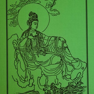 May include: A black and white line drawing of a seated figure with a halo, set against a green background. The figure is adorned with flowing robes and jewelry, and is surrounded by clouds and water. The artwork is framed with a black border.