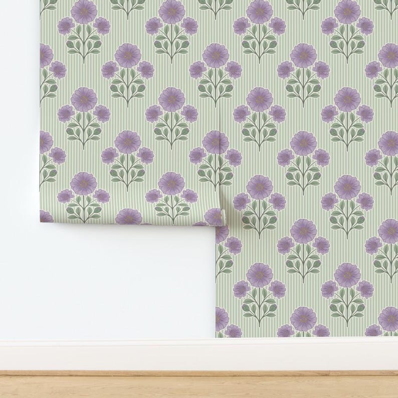 May include: Wallpaper featuring a repeating pattern of purple flowers with green leaves arranged on vertical stems. The background consists of thin, light green vertical stripes. The design is symmetrical, with each floral motif centered.