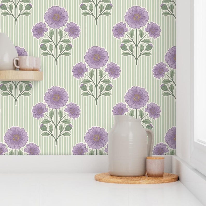 May include: Wallpaper featuring a repeating pattern of purple flowers with green leaves on a light green background with thin vertical white stripes. A light gray pitcher and a small cylindrical container sit on a wooden base.