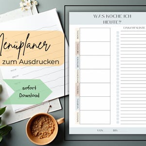 May include: A printable menu planner with the text "Men&uuml;planer zum Ausdrucken" in a handwritten font. The planner includes sections for each day of the week and a shopping list. A coffee cup and greenery are in the image.