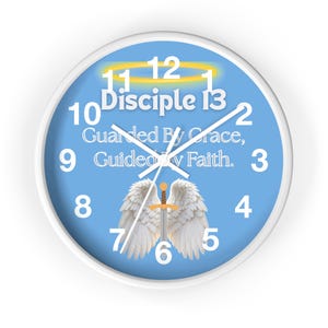 May include: A round wall clock with a white frame and a light blue face. The clock face features white numerals, the words "Disciple", "Guarded By Grace, Guided By Faith", and an illustration of angel wings and a sword.
