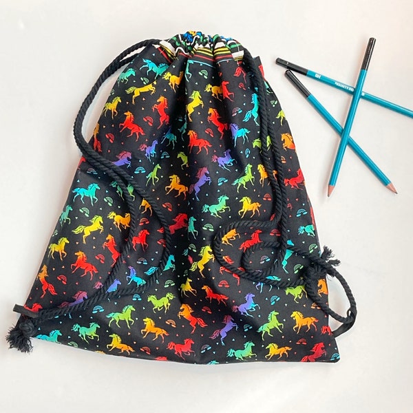 Drawstring school bag lined backpack in rainbow unicorns on black, overnight bag, gym or book bag