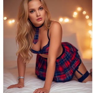 May include: A woman wearing a schoolgirl-inspired outfit. The ensemble includes a red and blue plaid skirt, a matching tie, and a dark blue bra. The woman is kneeling on a white bed.
