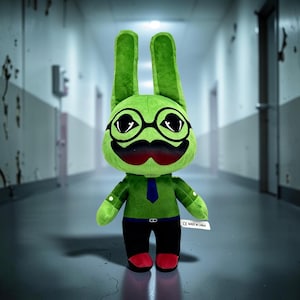 May include: A plush toy shaped like a green rabbit with long ears, wearing black glasses and a black mustache. It has a green shirt with a blue tie, black pants, and red shoes. A white tag on the side reads CE MADE IN CHINA in black text.