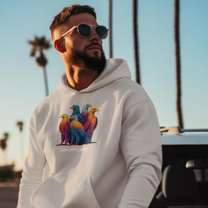 May include: Cream-colored hoodie with a front pocket and a colorful graphic of eagles. The graphic includes the text "A Convocation of Eagles". The hoodie is worn by a person wearing sunglasses.