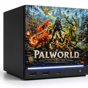 May include: A black compact computer tower featuring a Palworld graphic on the front panel. The design displays various creatures, a character, and the text Palworld Survive Craft Explore Bond Conquer. A thin blue light strip sits above the ports.