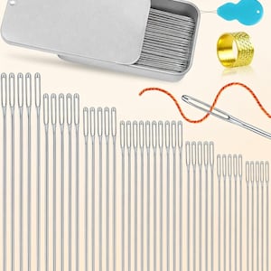 May include: A sewing kit with various needles, threaders, and a thimble. The kit includes a silver metal box filled with needles, two threaders in red and blue, a gold thimble, and a needle threaded with orange thread. The needles are of varying lengths.