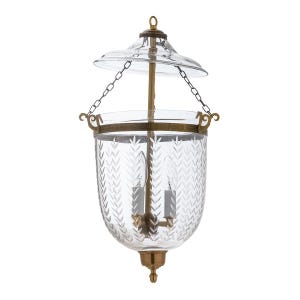 May include: Clear glass hanging lantern with etched leaf pattern. Features a brass frame, chain, and decorative accents. Includes two light bulbs. The lantern has a clear glass top and a decorative bottom finial.