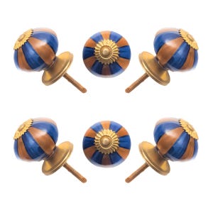 May include: Six decorative cabinet knobs. Each knob has a blue and brown striped pattern with a gold-colored base and a gold-colored floral design on top. The knobs are on a white background.