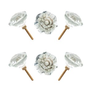 May include: Clear glass cabinet knobs with faceted diamond-like shapes. Each knob has a gold-colored screw for installation. The knobs are arranged in a circular pattern against a white background. These decorative knobs are suitable for furniture.