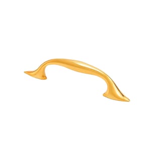 May include: A gold-colored cabinet pull handle with a curved design. The handle has a smooth, polished finish and is set against a white background. The handle is a decorative hardware element for furniture.