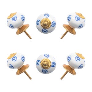 May include: White ceramic cabinet knobs with blue swirl designs and gold accents. The knobs have a brass-colored base and a threaded screw for installation. Decorative hardware for furniture.