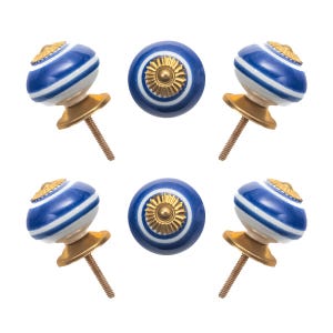 May include: Six decorative cabinet knobs. The knobs are blue and white with a gold-colored base and screw. The knobs have a striped design and a gold-colored floral pattern on top.