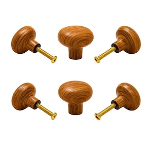 May include: Six wooden cabinet knobs with a warm brown wood grain finish. Each knob has a rounded top and a brass-colored screw for easy installation. The knobs are designed for furniture and home decor.