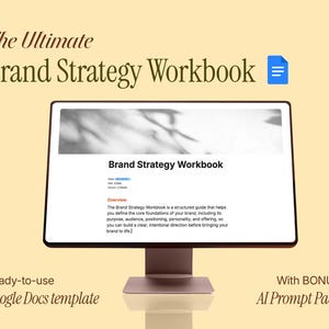 May include: A computer monitor displaying The Ultimate Brand Strategy Workbook as a Google Docs template. The screen shows a document header, a title, status, date, owner fields, and an overview paragraph. A blue document icon is visible.